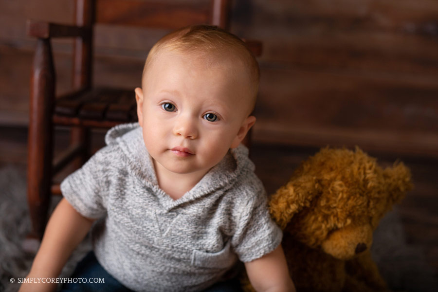 Carrollton baby photographer, one year old with a teddy bear