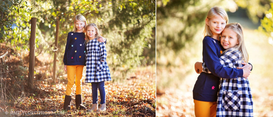Bremen family photographer, sisters hugging outside in fall