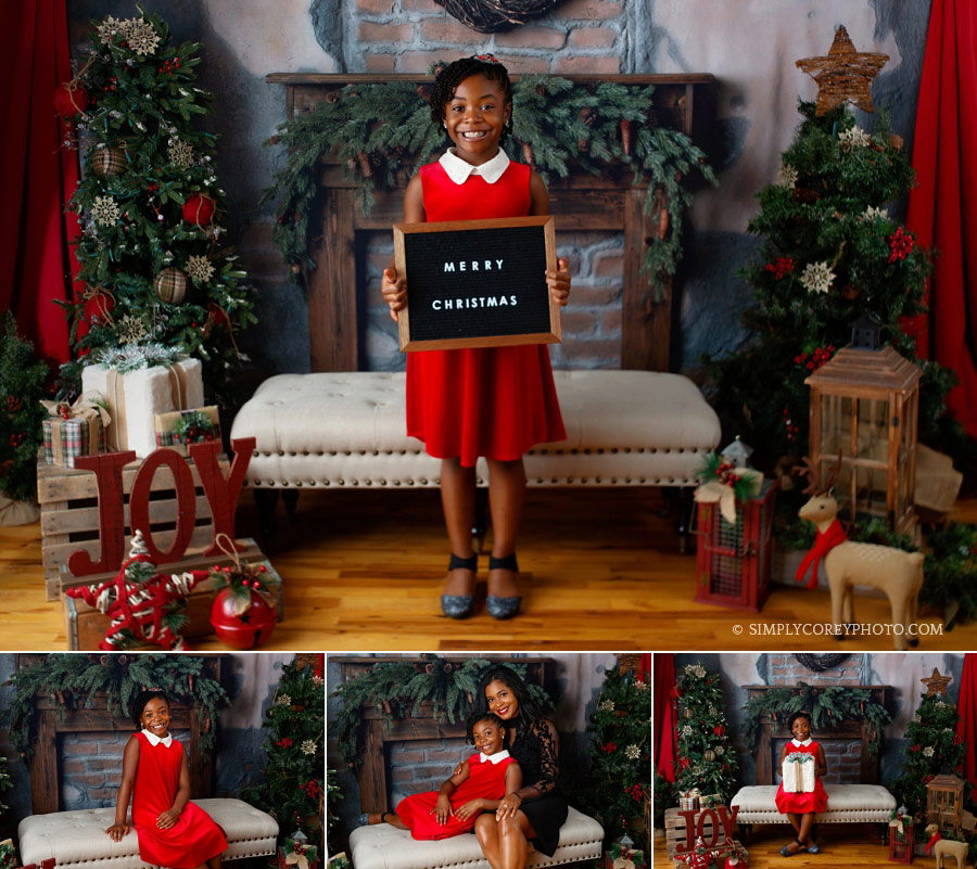 Christmas mini session near Carrollton, Georgia; girl in red with a letter board