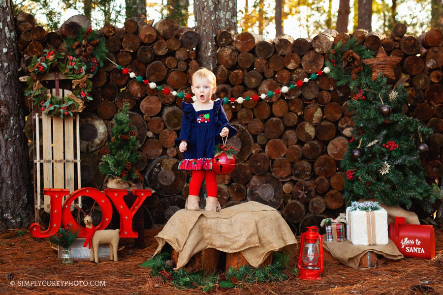 Newnan outdoor Christmas mini sessions, baby girl with surprised face