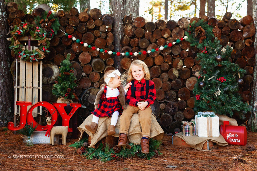 outdoor Christmas mini sessions Carrollton, Georgia, siblings in buffalo checks