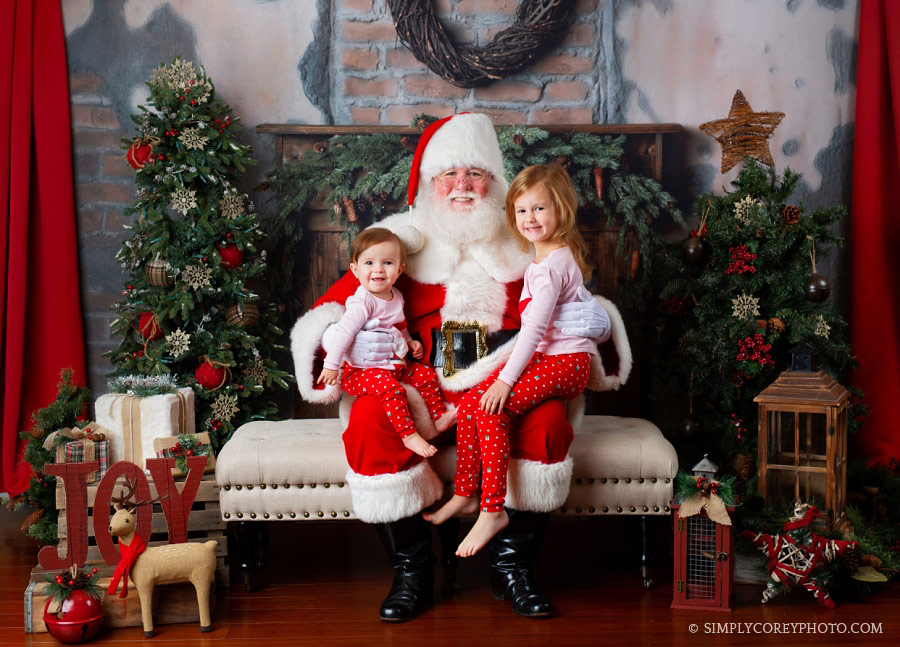 Carrollton Santa Claus mini sessions, girls in pink Christmas pajamas