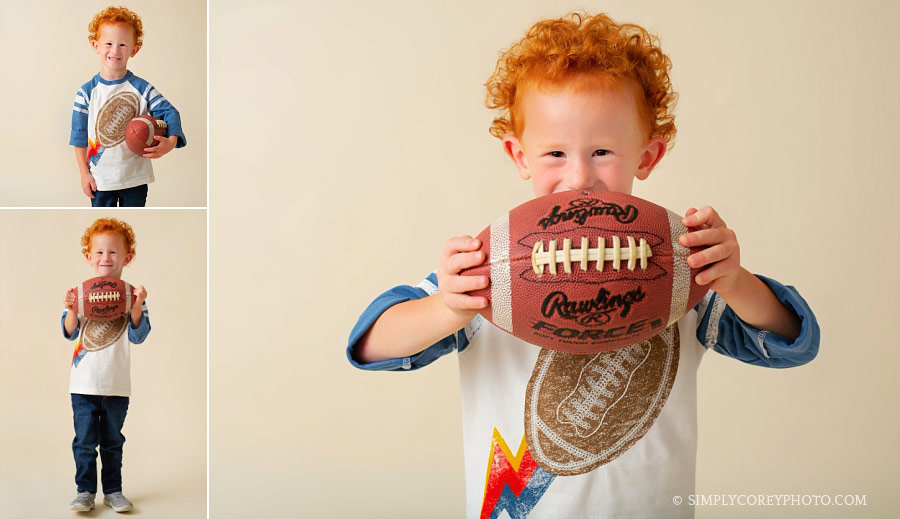 Atlanta children's photographer, redhead boy with a football in studio
