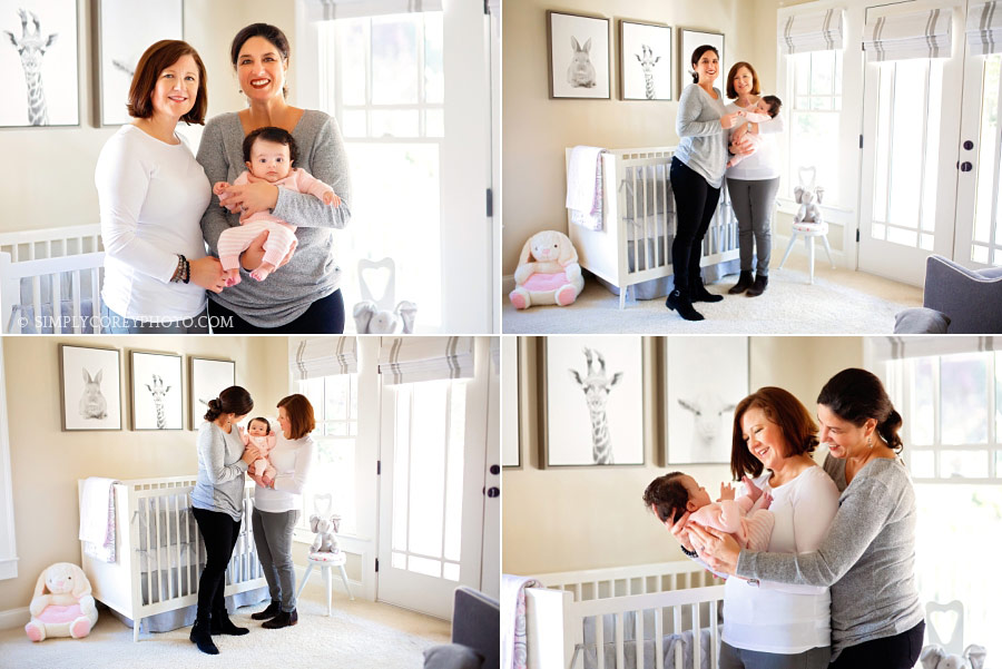 Bremen lifestyle photographer, parents holding baby in nursery