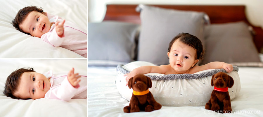 Douglasville lifestyle photographer, baby on bed with stuffed animal dogs
