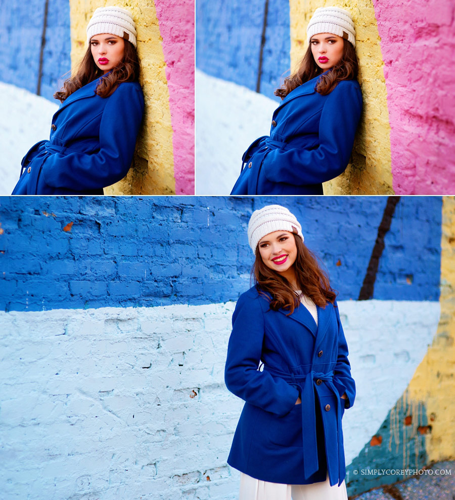 Newnan senior portraits of a teen in blue by a colorful wall downtown