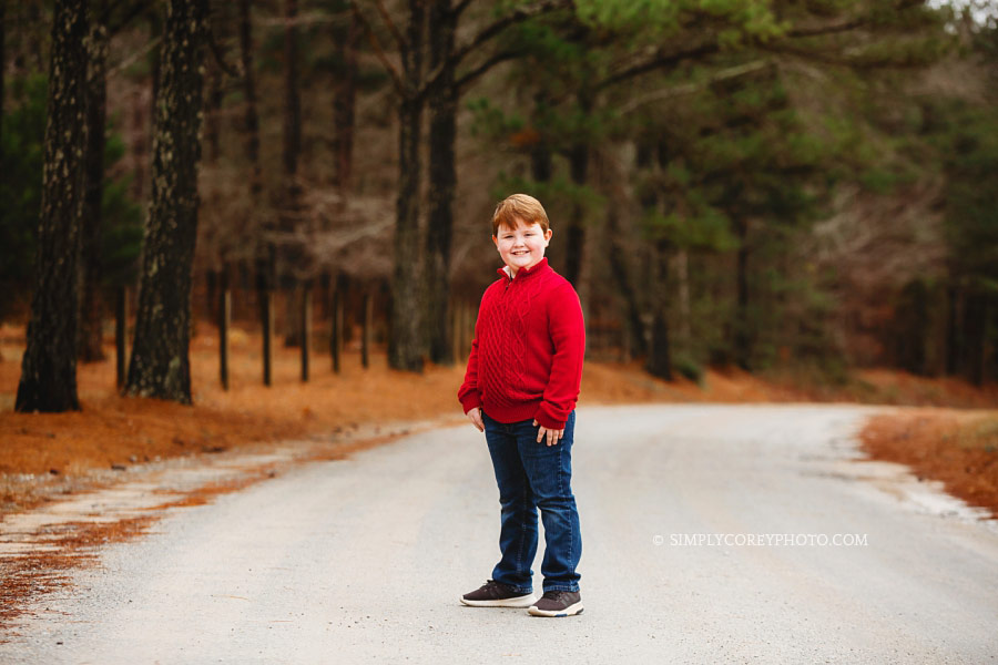 children's photographer near Douglasville, redhead boy outside in a red sweater