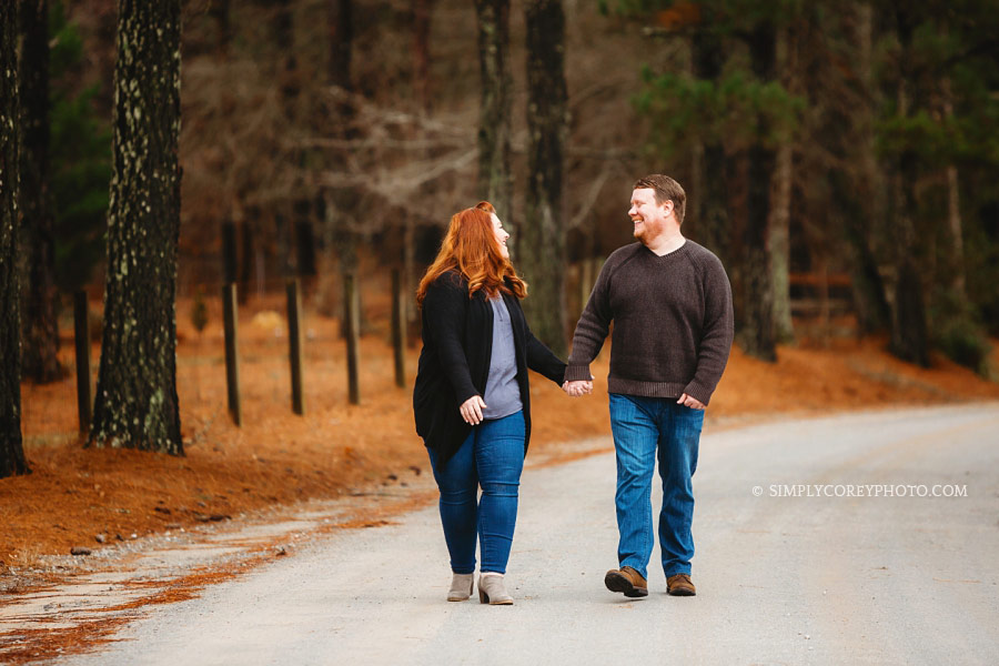 Douglasville couples photographer, parents walking country road during family session
