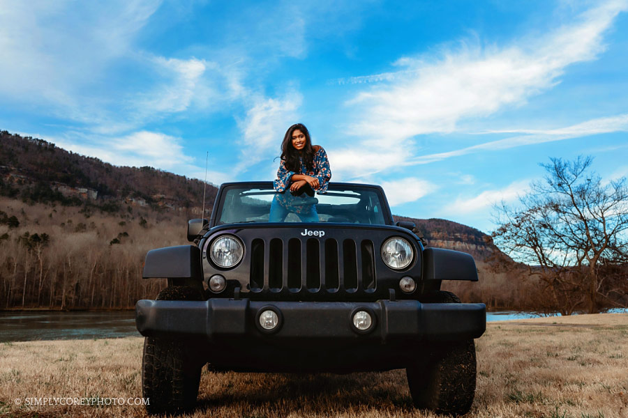 senior portrait photographer near Carrollton, Georgia; teen outside in a Jeep