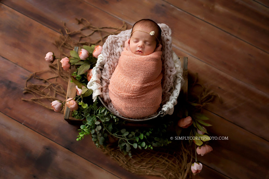 Atlanta newborn photographer, baby girl in pink wrap with flowers