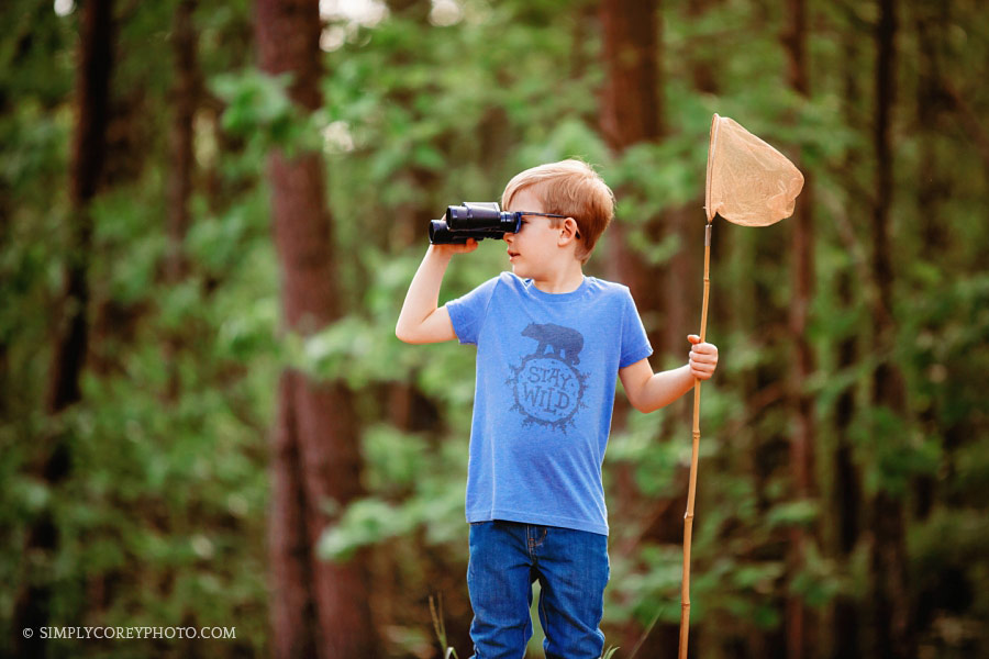 Atlanta commercial photographer, child model outside with binoculars
