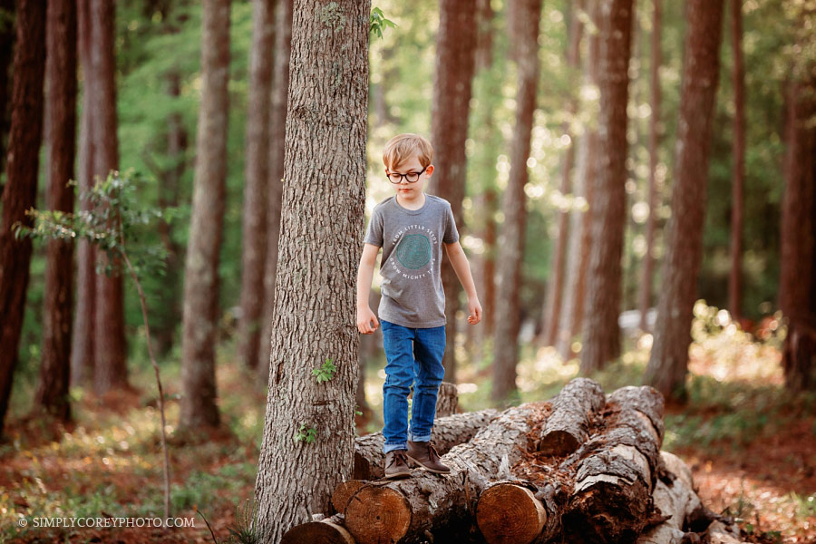 Newnan commercial photographer, child walking on log outside