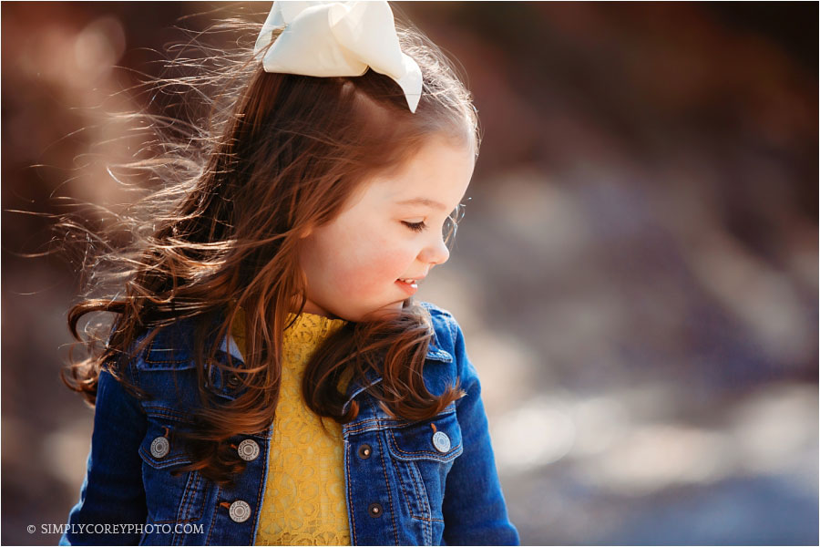 Atlanta children's photographer, profile of a girl outside in a denim jacket