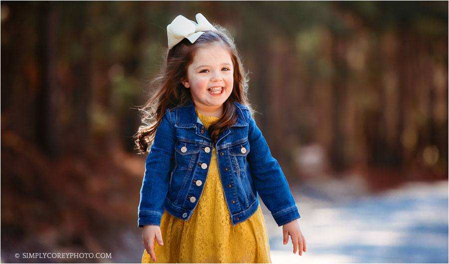 children's photographer Carrollton, Georgia; little girl outside in a jacket