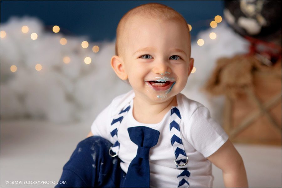 baby photographer Newnan, boy with frosting on face during a cake smash