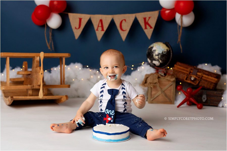 Douglasville cake smash photographer, baby eating blue and white cake
