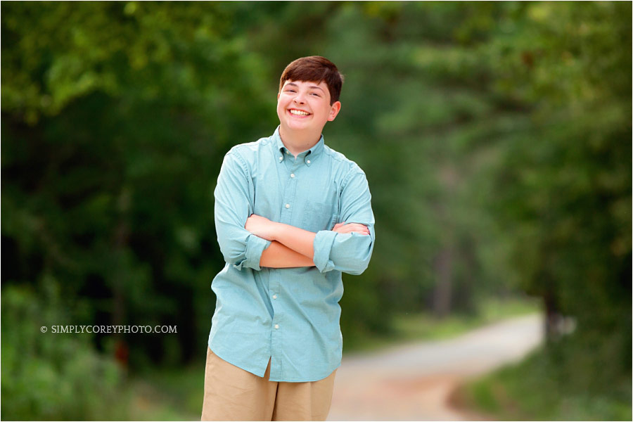 Atlanta teen photographer, boy smiling outside in country