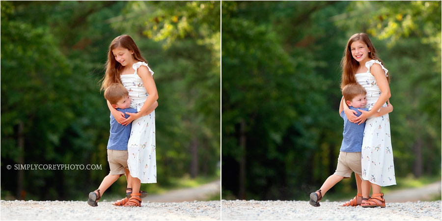 Carrollton family photographer, siblings hugging on a country road