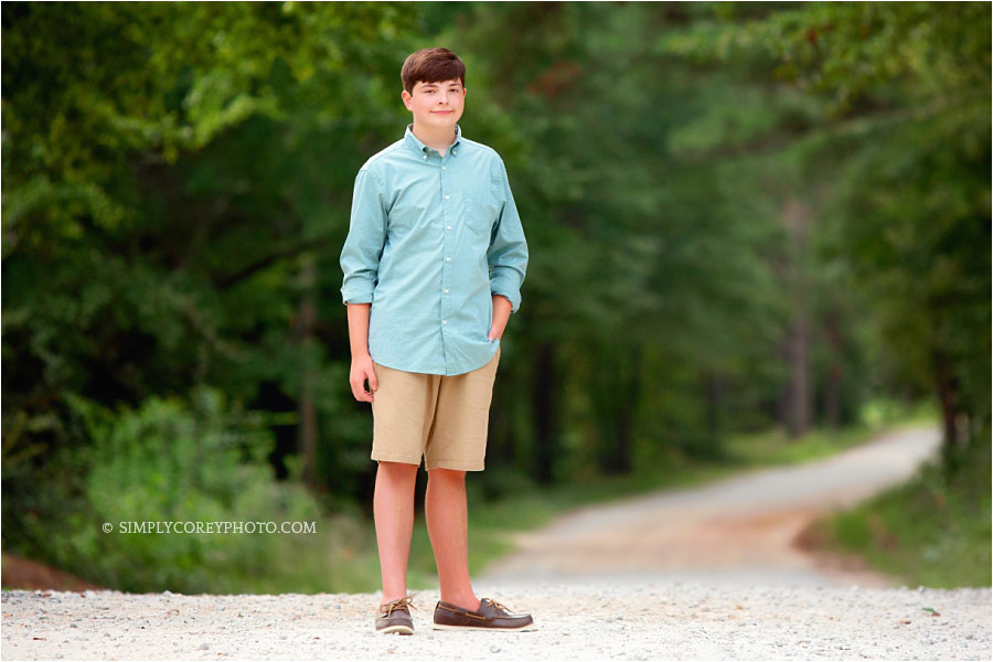 Carrollton photographer, teen boy outside standing on a dirt road