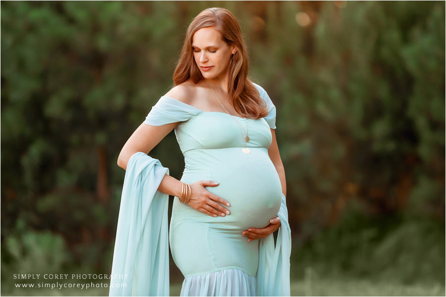 Newnan maternity photographer, expecting mom outside in green dress
