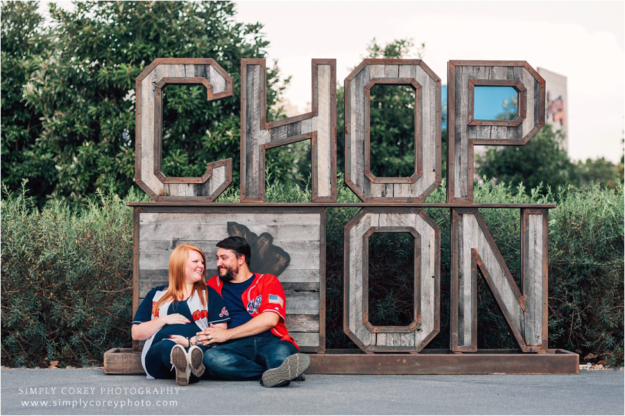 Atlanta maternity photographer, couple by Chop On sign at SunTrust Park