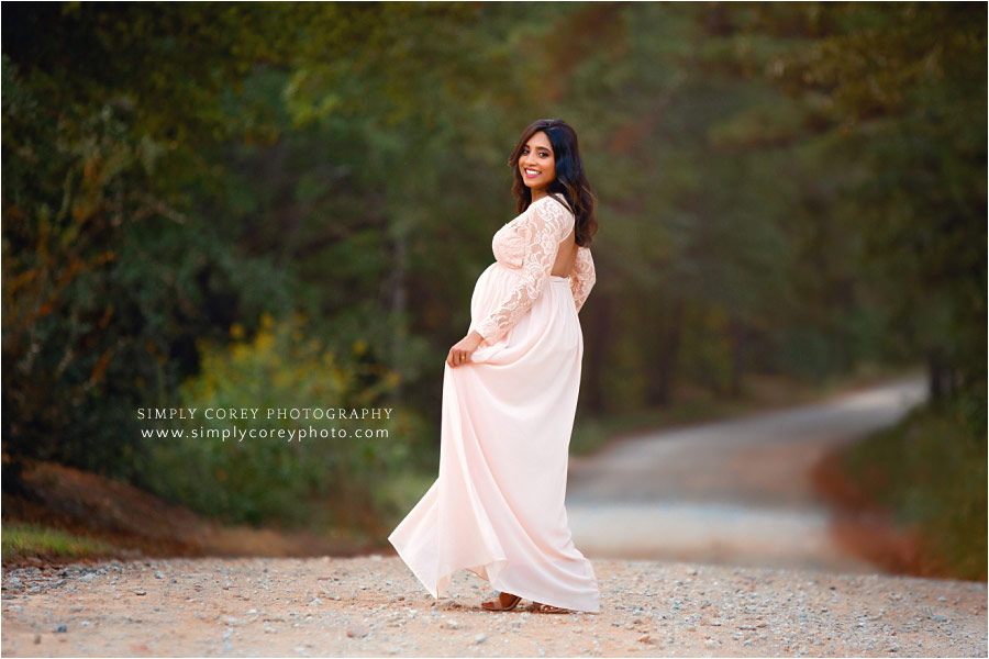 Atlanta maternity photographer, mom in blush dress on a country road