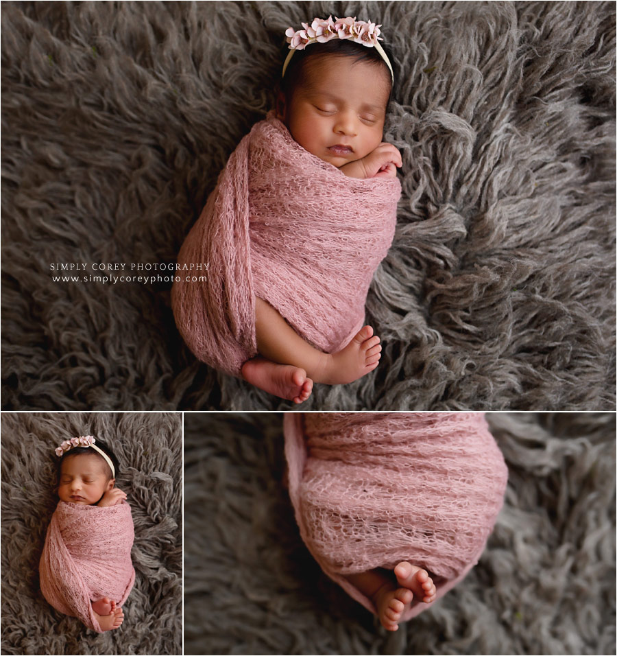 Newnan newborn photographer, baby in pink wrap on fur