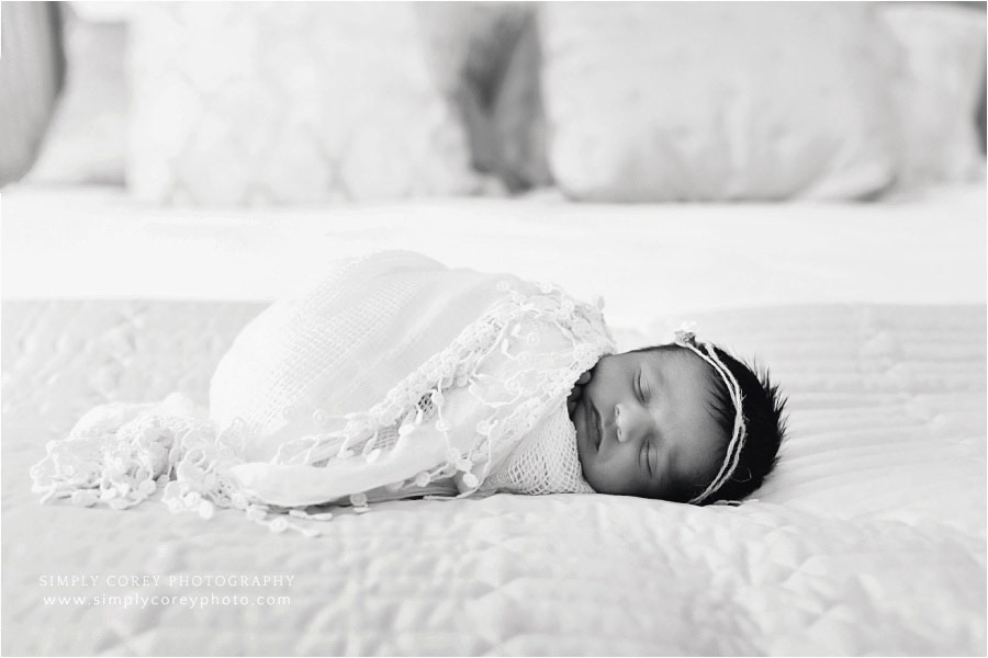 Villa Rica photographer, in home newborn session with baby on bed