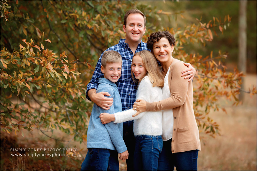 Atlanta family photographer, outdoor group photo by fall tree