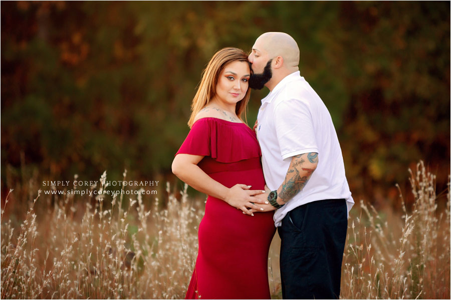 maternity photographer in West Georgia, expecting couple outside in fall