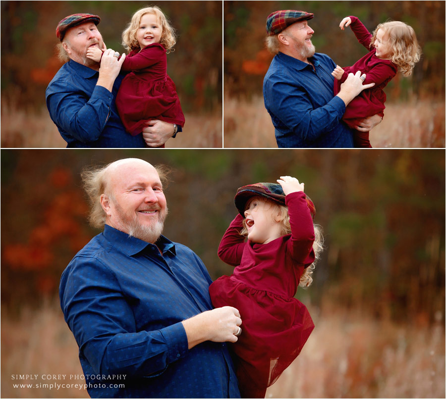 extended family photographer near Douglasville, grandchild playing with grandpa's hat