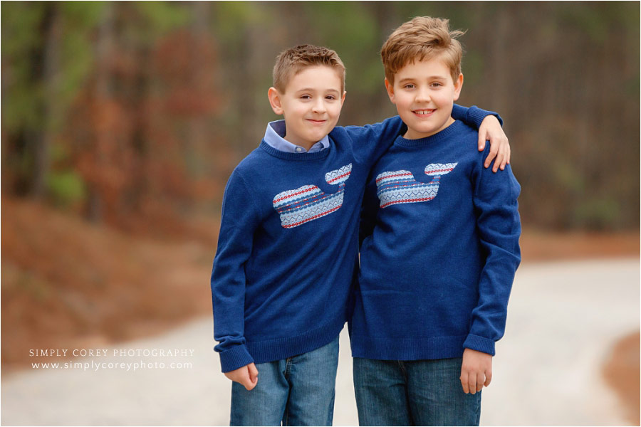 Villa Rica family photographer, brothers outside on dirt road