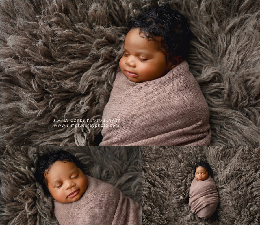 Bremen newborn photographer, baby swaddled on brown fur