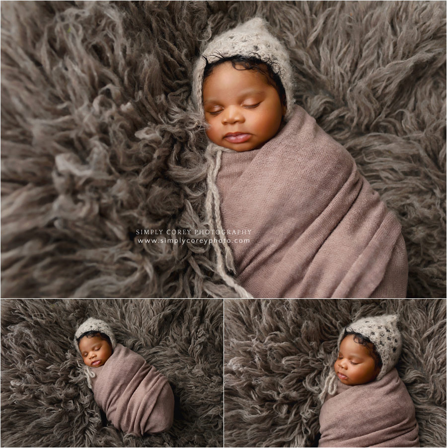 Newnan newborn photographer, baby boy on brown fur with hat