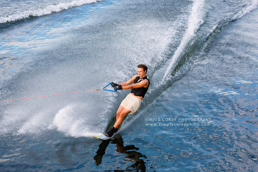 Atlanta photographer, teen wakeboarding on lake Lanier during lifestyle session