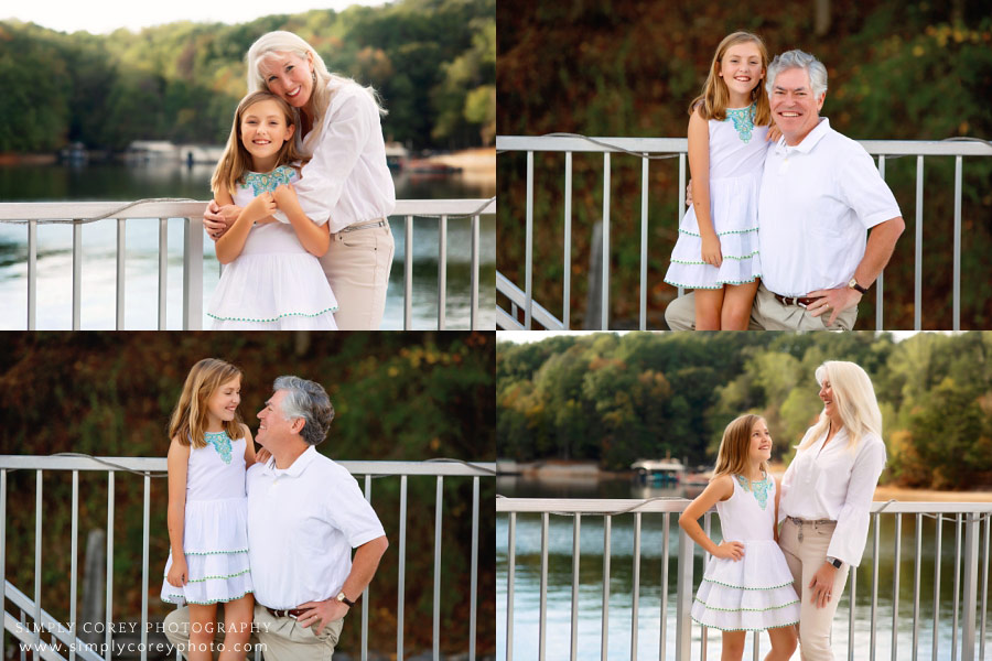 Newnan family photographer, parents with daughter by Lake Lanier