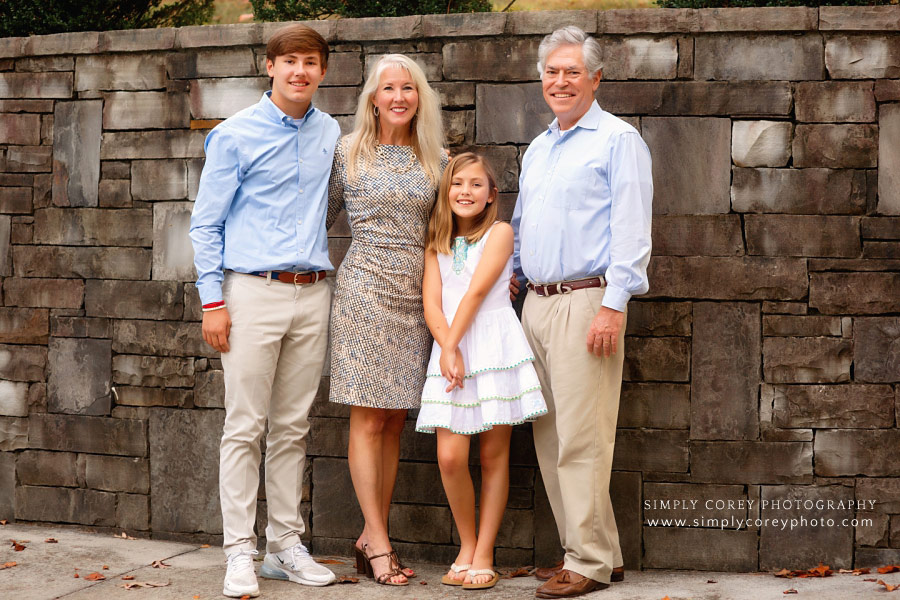 West Georgia family photographer, family of four by a stone wall