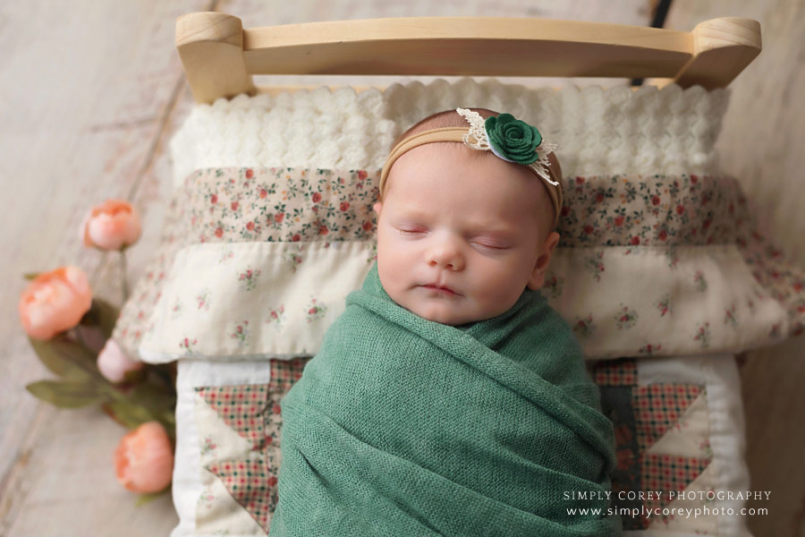 Atlanta newborn photographer, baby in green and peach with quilt
