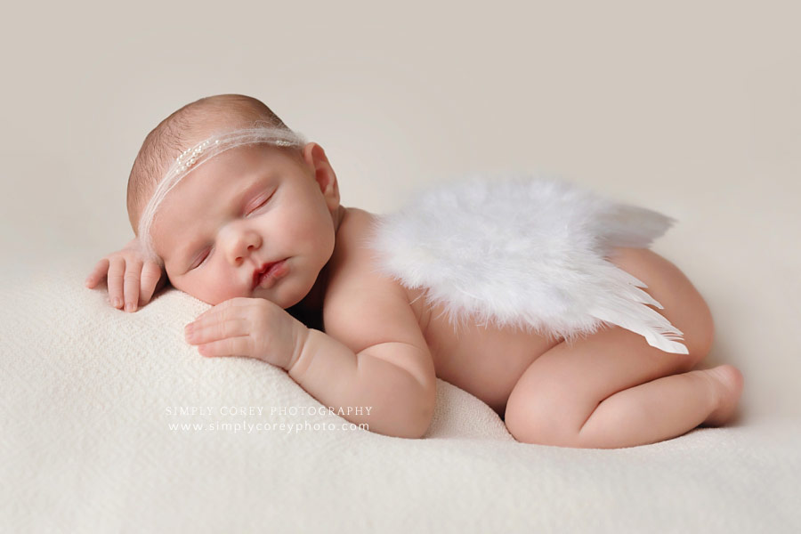 Newnan newborn photographer, baby girl with angel wings and pearl headband