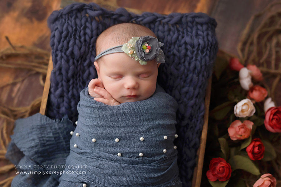 Atlanta newborn photographer, baby girl in blue wrap with roses