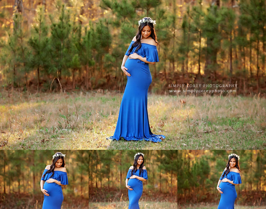 Douglasville maternity photographer, mom in royal blue dress outside by pines