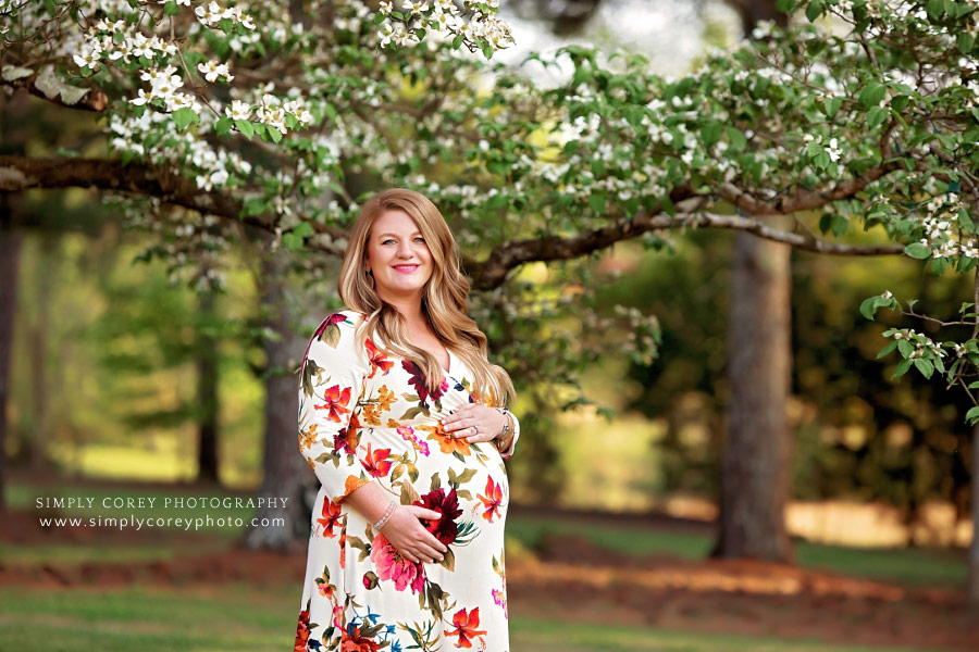 Atlanta maternity photographer, mom pregnant with twins by Dogwood tree