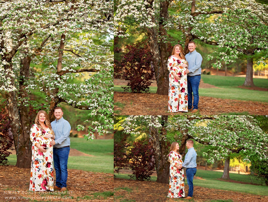 Newnan maternity photographer, couple by Dogwood tree in spring