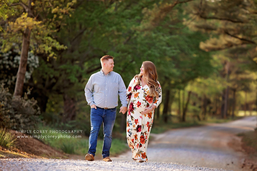 Villa Rica maternity photographer, couple walking on country road