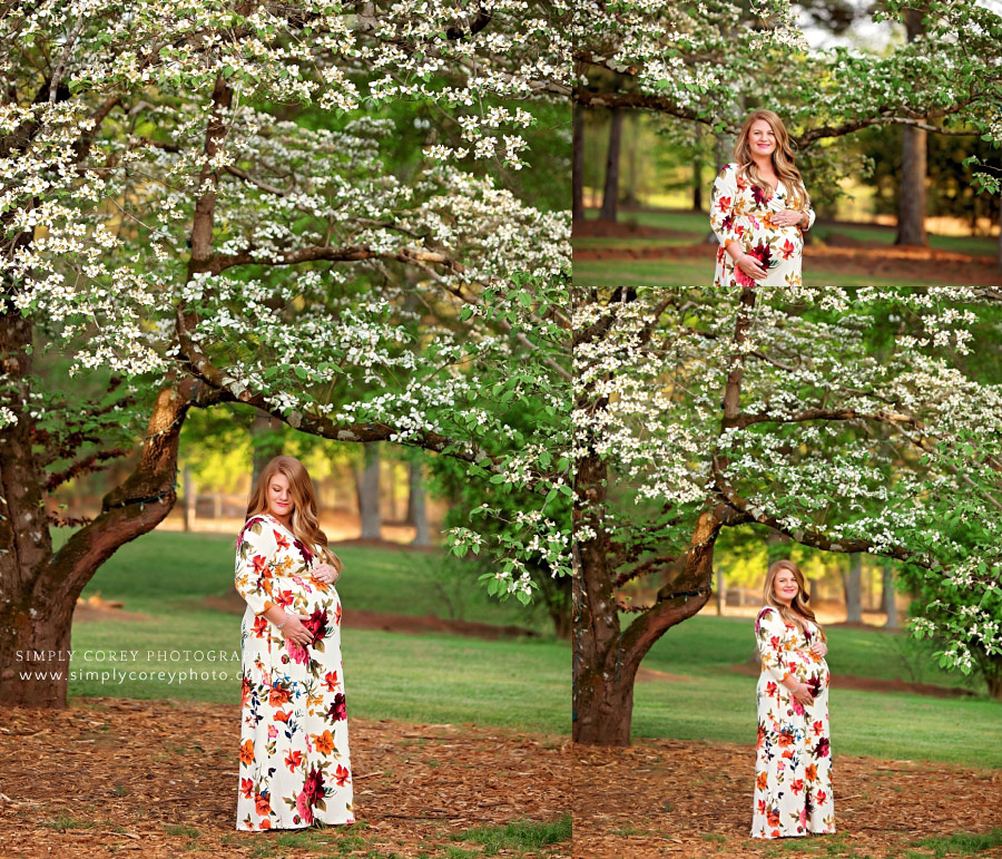 Villa Rica maternity photographer, mom in floral dress by Dogwood tree