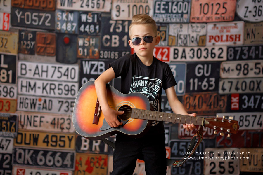 Atlanta kids photographer, child in Johnny Cash shirt with guitar
