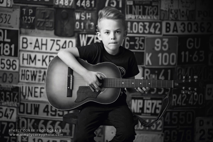 child photographer in West Georgia, black and white photo of boy and guitar