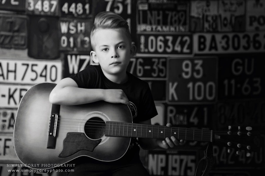 West Georgia photographer, black and white studio portrait of child with guitar