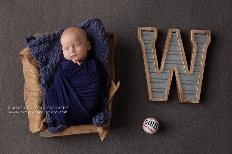 Newnan newborn photographer, baby in blue with baseball