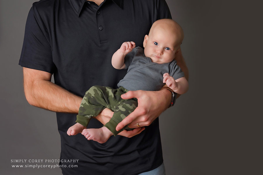 West Georgia family photographer, dad holding baby boy